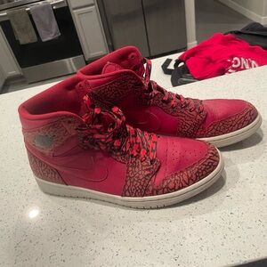 Size 10.5 men’s Jordan 1s, main color red, accent color black